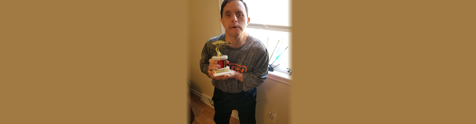 boy holding an award